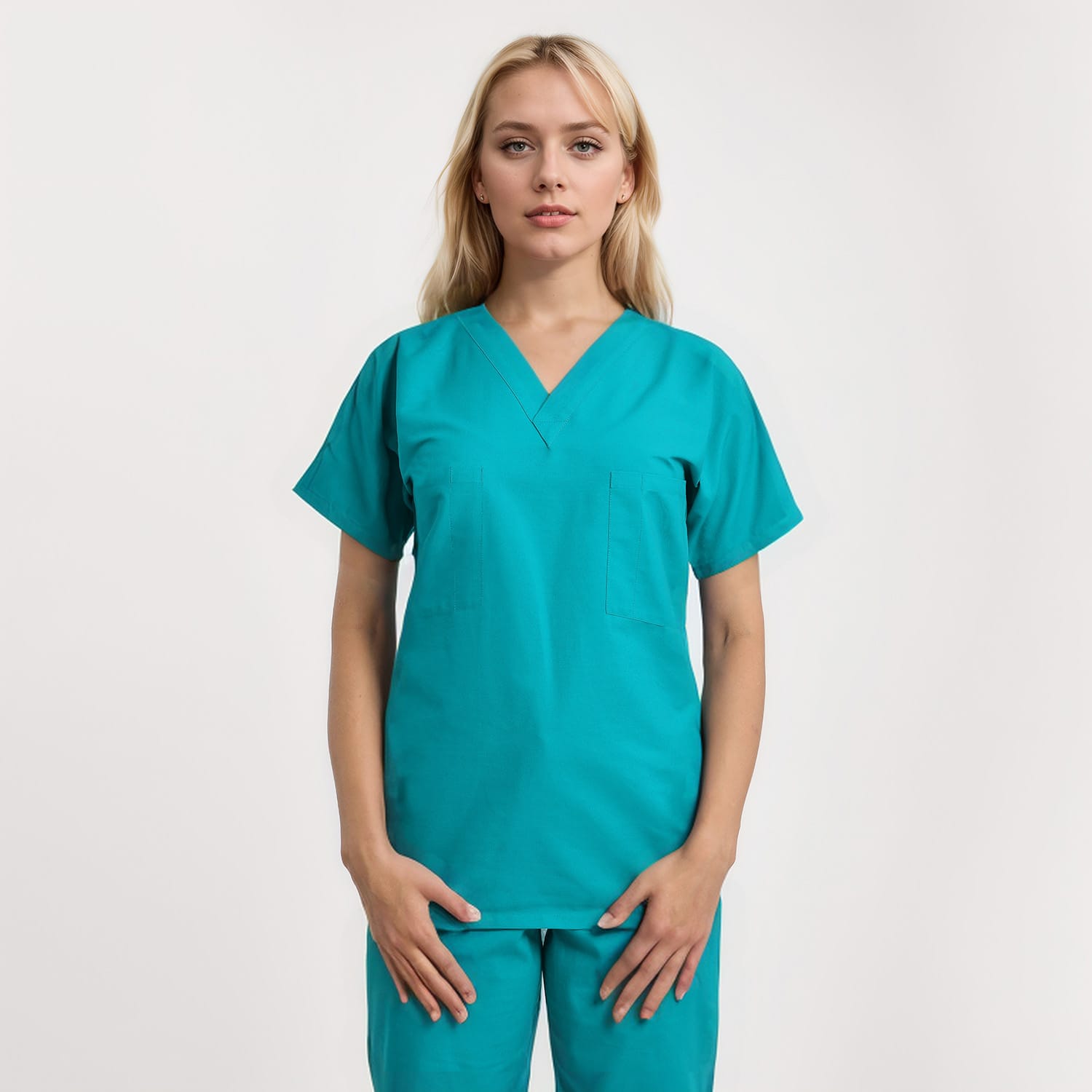 Front view of a model wearing a reversible V-neck scrub top in unisex style with one pocket, designed for healthcare professionals.