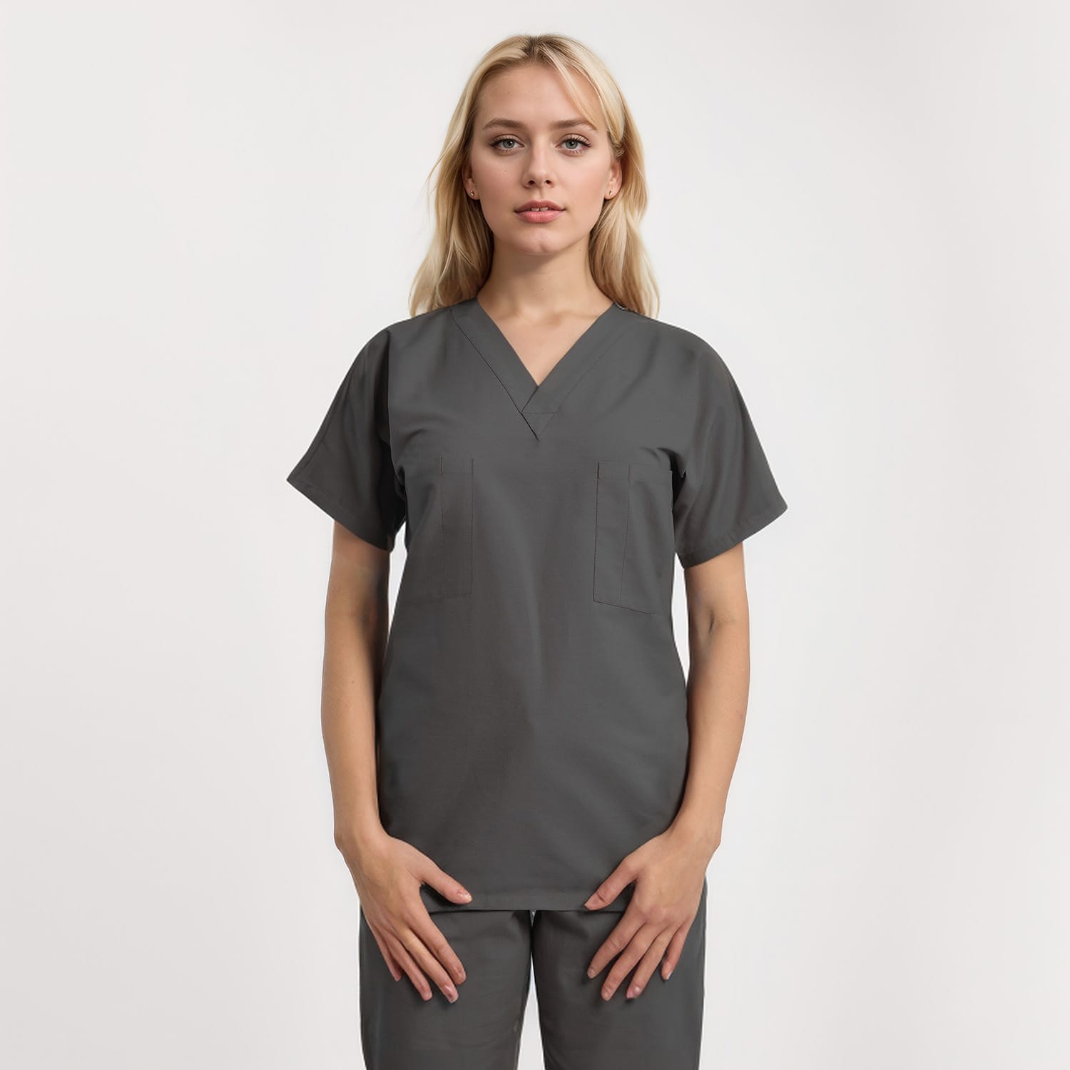 Front view of a model wearing a reversible V-neck scrub top in unisex style with one pocket, perfect for healthcare workers.