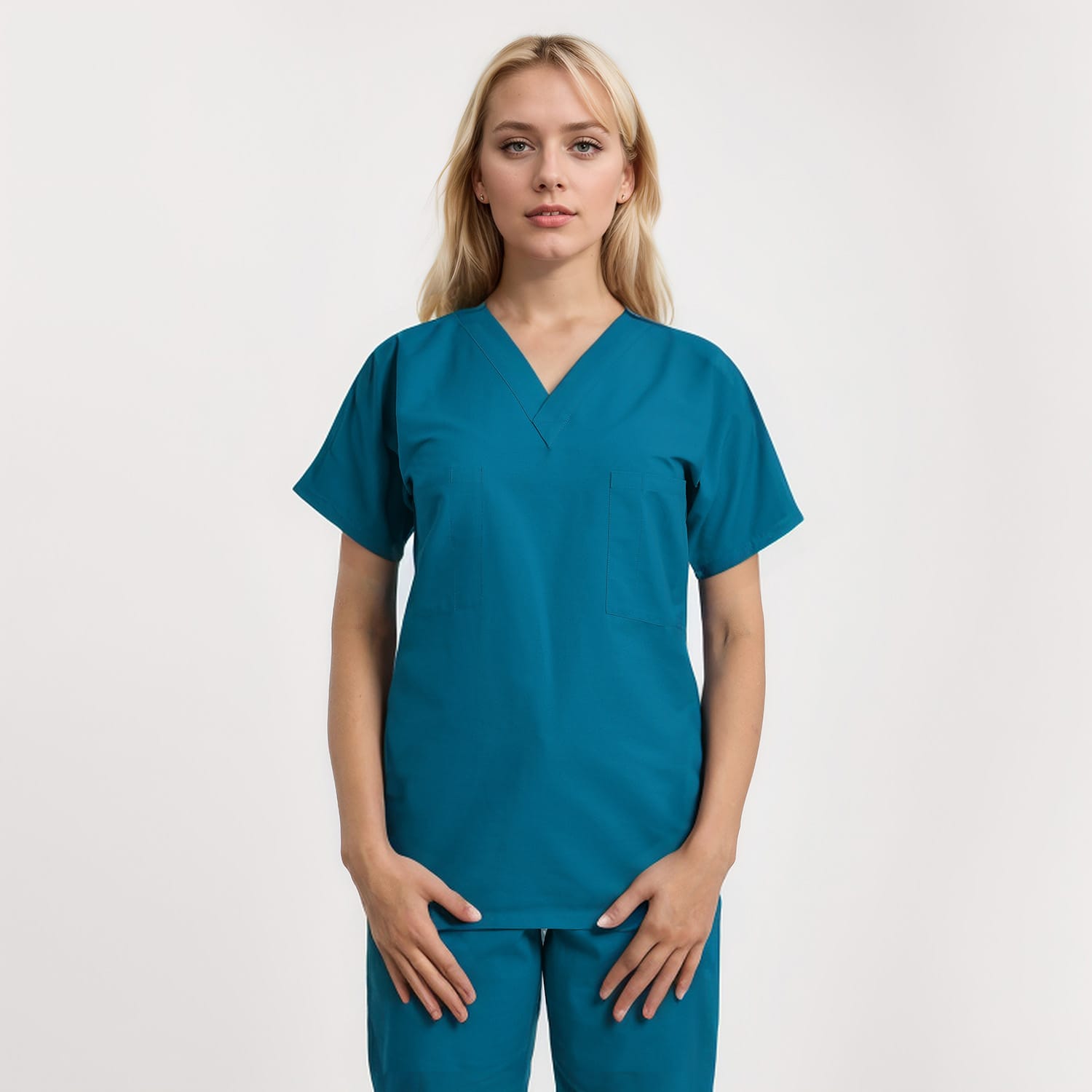Front view of a model wearing a reversible V-neck scrub top in unisex style with one pocket, perfect for healthcare workers.