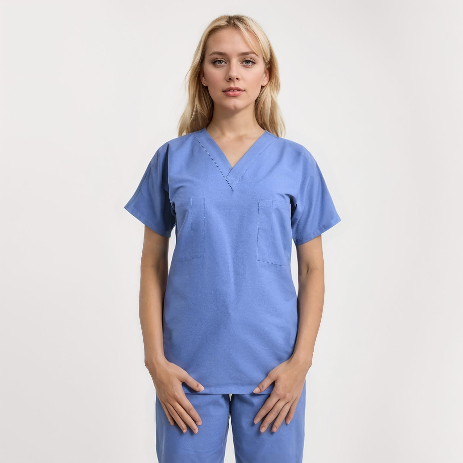Front view of a model wearing a reversible V-neck scrub top in unisex style with one pocket, ideal for healthcare workers.