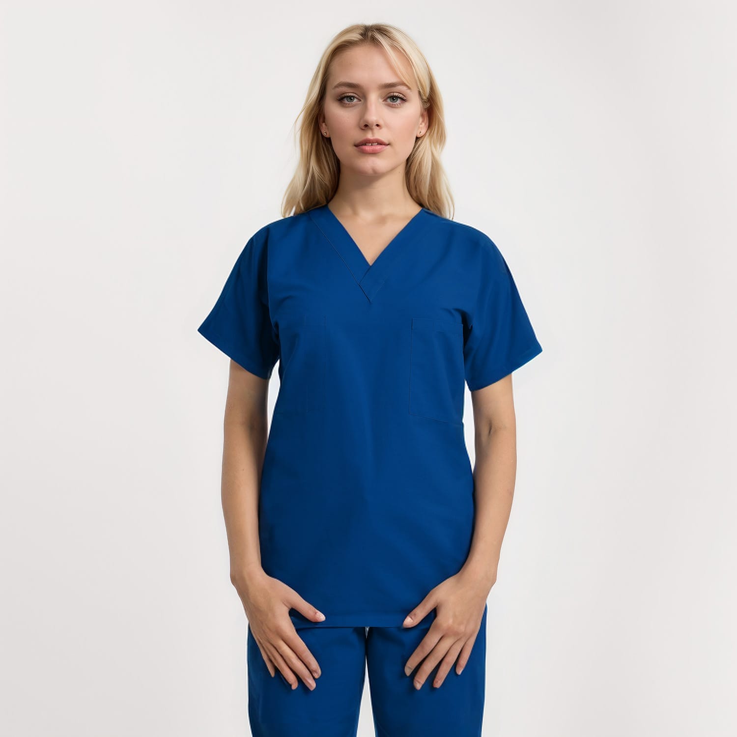 Front view of a model wearing a reversible V-neck scrub top in unisex style with one pocket, designed for healthcare professionals.