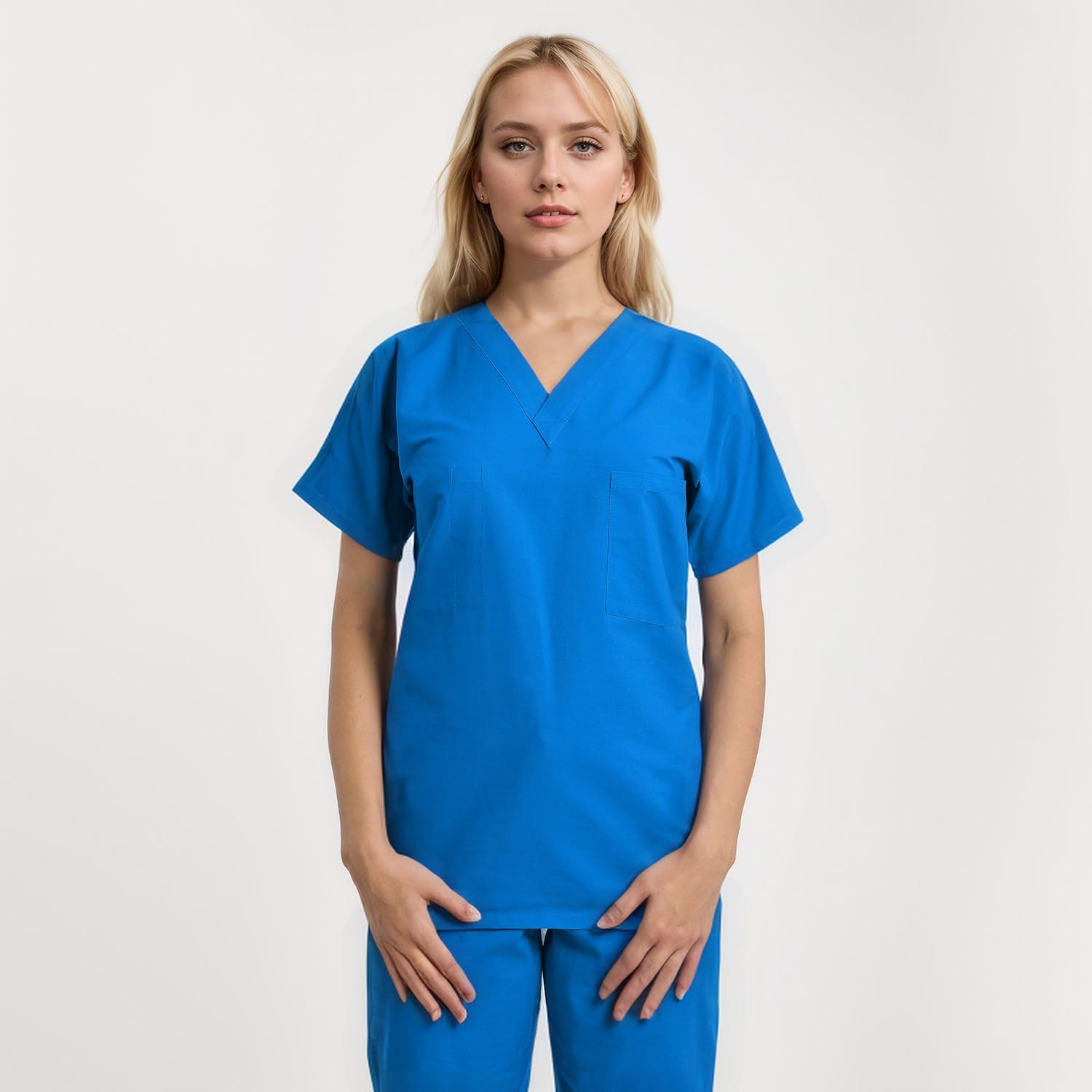 Front view of a model wearing a reversible V-neck scrub top in unisex style with one pocket, designed for healthcare professionals.