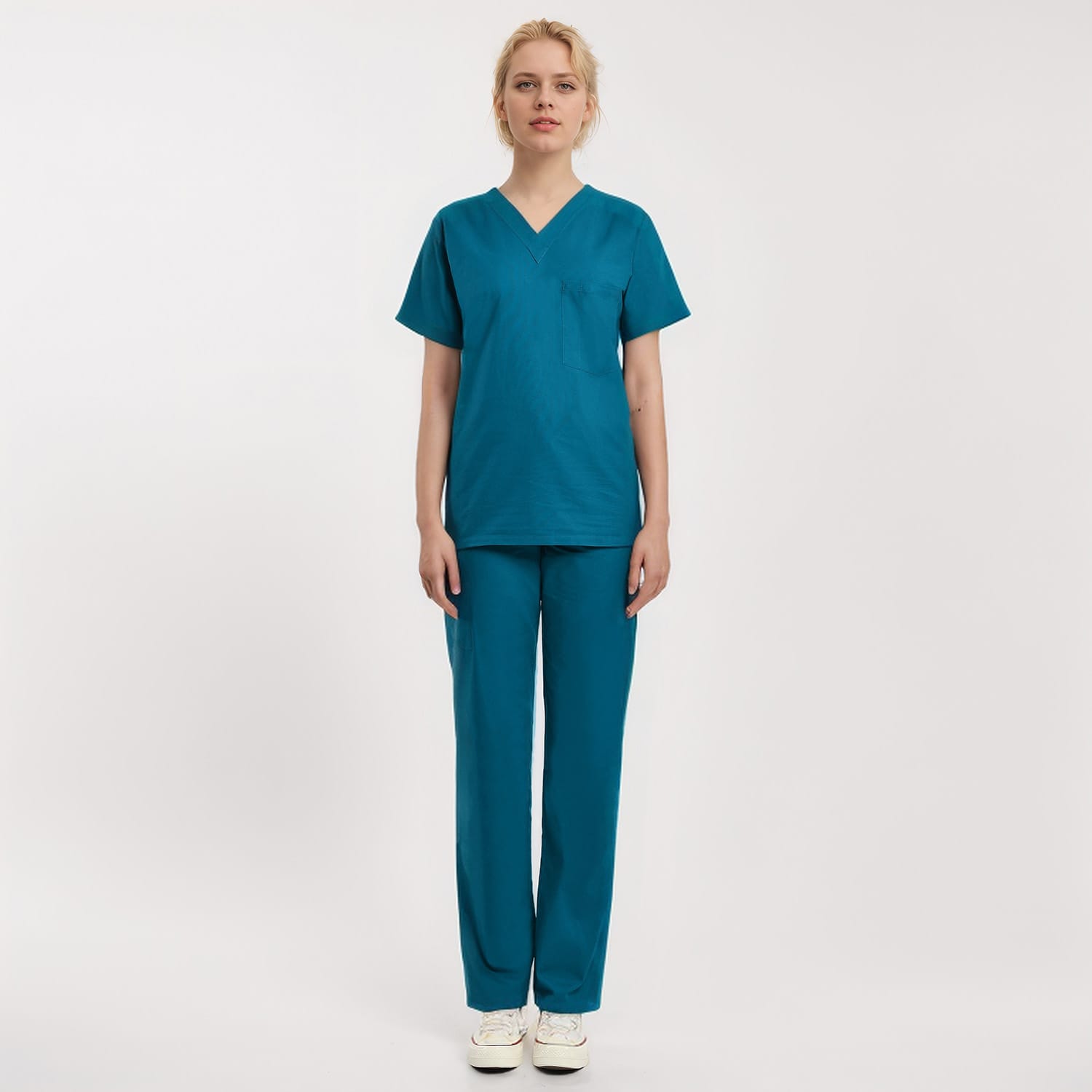 Front view of a model wearing a teal Scrub Unisex 1-Pocket V-Neck Scrub Top, ideal for healthcare workers.