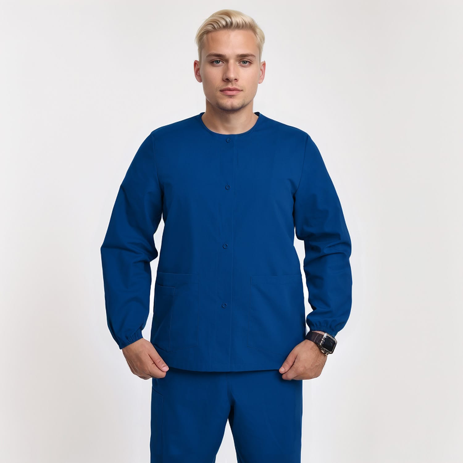 Front view of a model wearing a dark blue unisex 3-pocket warm-up scrub jacket with long sleeves, ideal for healthcare professionals.