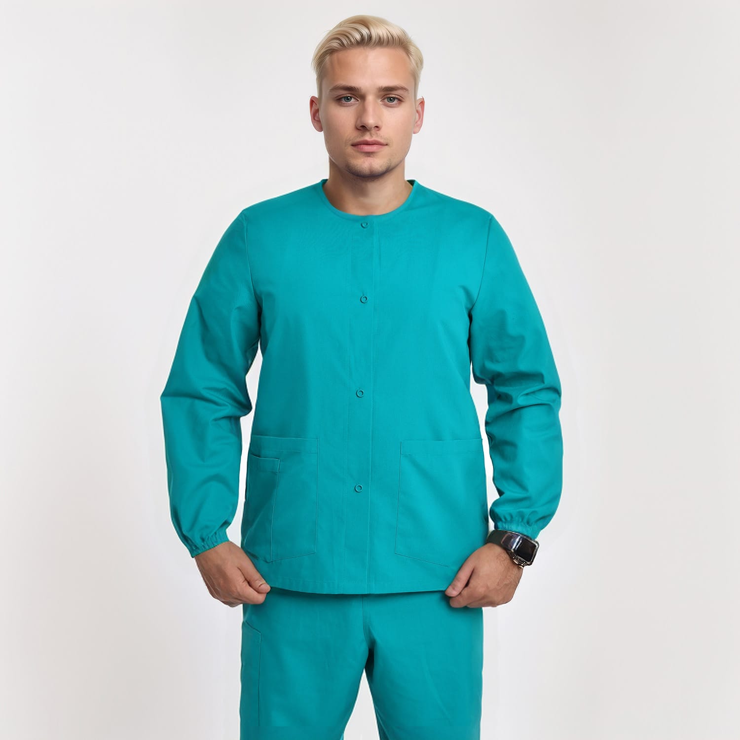 Front view of a model wearing a teal unisex 3-pocket warm-up scrub jacket with long sleeves, ideal for healthcare workers.