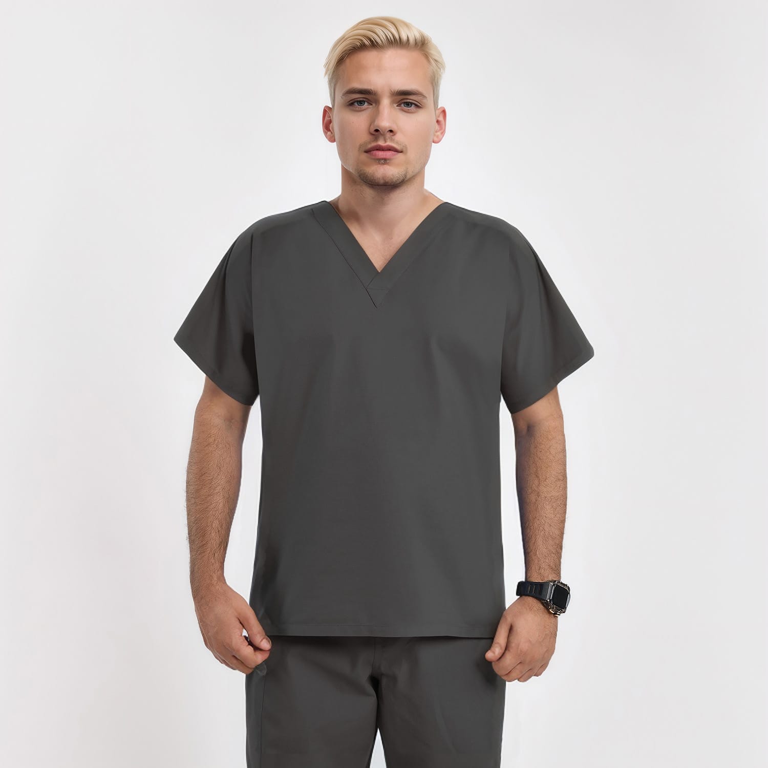 Front view of a male model wearing a dark gray unisex V-neck scrub top, ideal for healthcare professionals seeking both style and functionality.