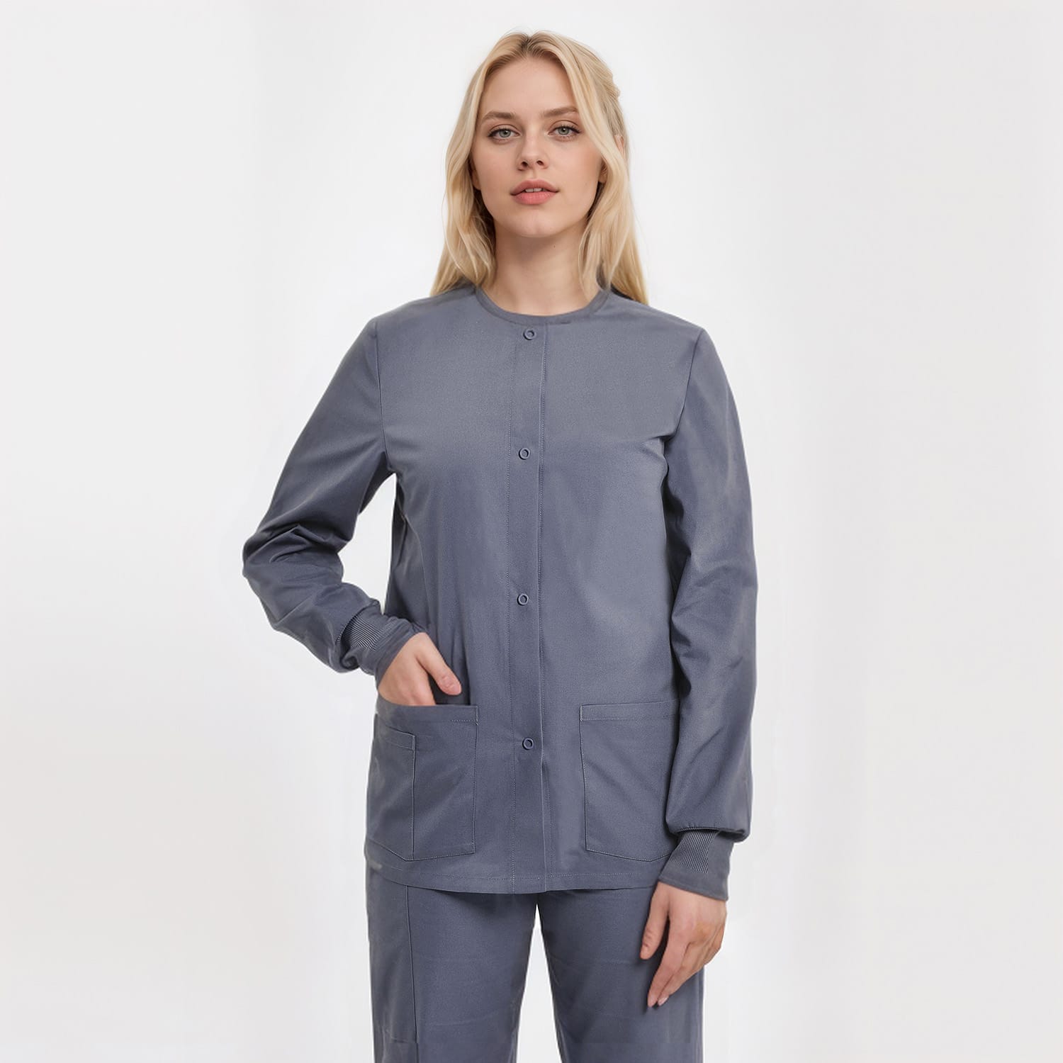Unisex scrub jacket in grey with three pockets, designed for healthcare professionals. Durable and practical for medical work.