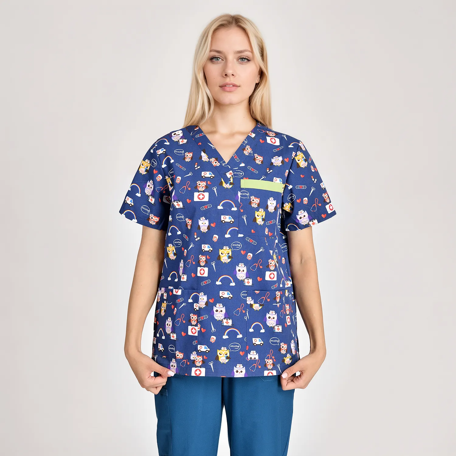 Women's cartoon print medical scrub top, featuring a playful design, practical pockets, and a comfortable fit for healthcare professionals.