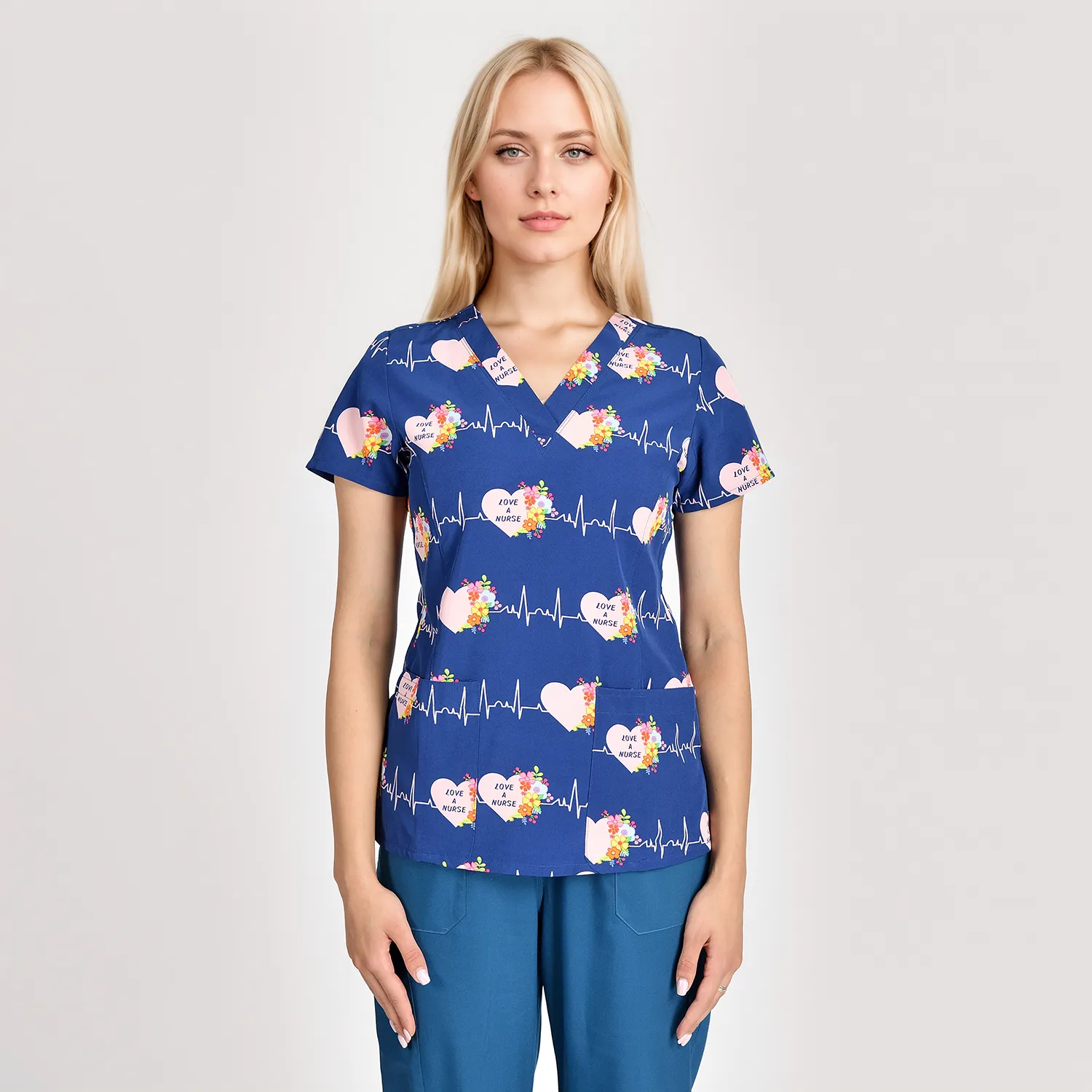 Front view of a women's blue heart print medical scrub top, designed with a V-neck and short sleeves, ideal for healthcare workers.