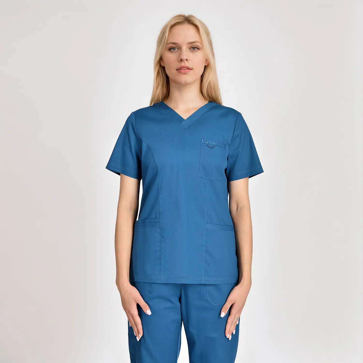 Women's V-neck scrub top in blue, featuring three practical pockets for healthcare professionals, offering comfort and functionality.