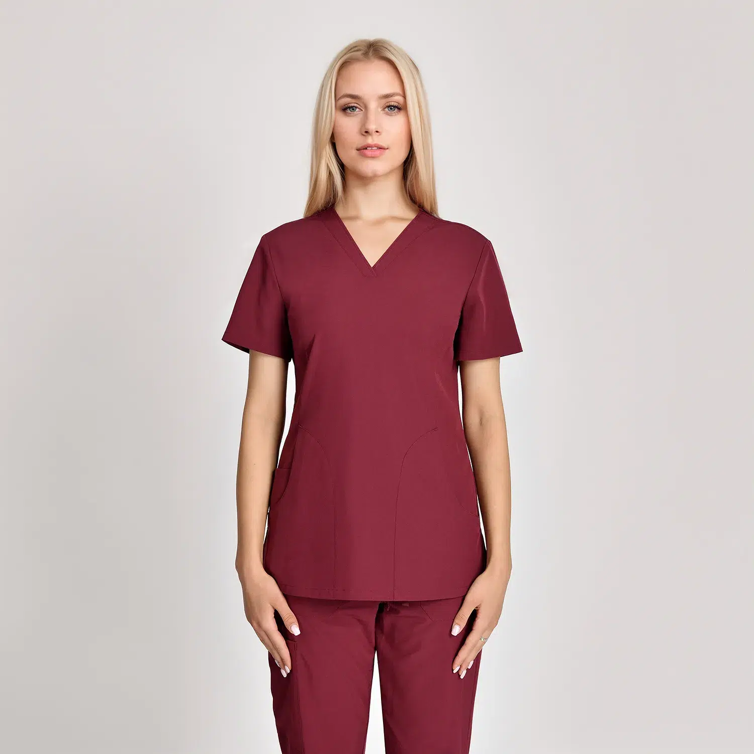 Burgundy women's V-neck medical scrub top with short sleeves and two functional pockets, offering a professional and stylish look for healthcare workers.
