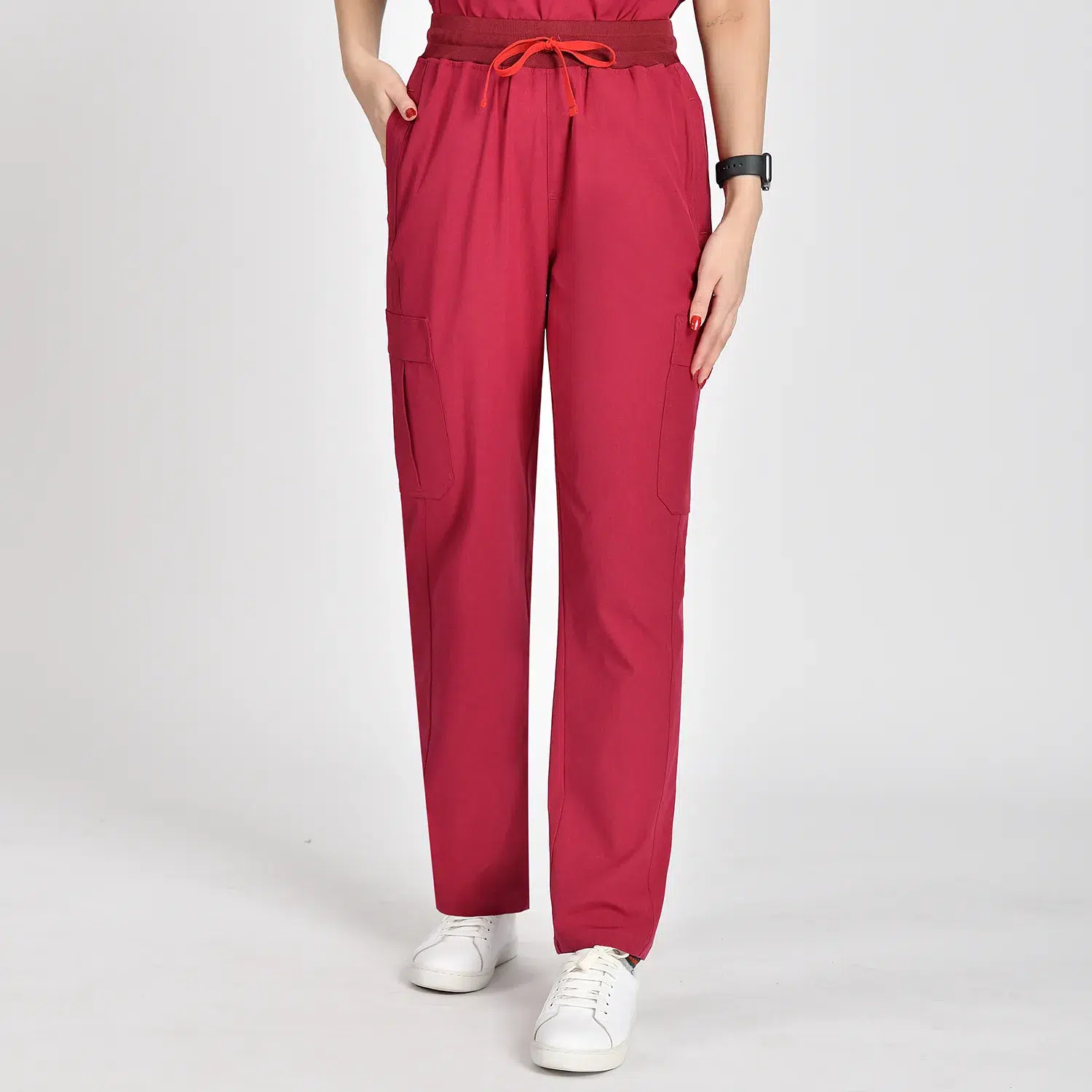 Front view of modern women’s scrub pants with drawstring waist, functional pockets, and ankle cuffs, designed for comfort and practicality in healthcare settings.