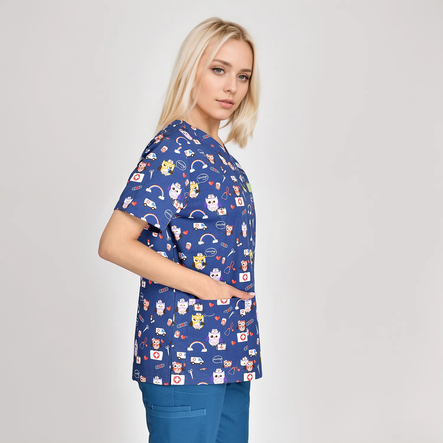 Custom Fashion Cartoon Print Medical Scrub Top for Women Stylish Comfortable Healthcare Top Side view of a women's cartoon print medical scrub top, offering comfort and style with a playful design, perfect for healthcare professionals.