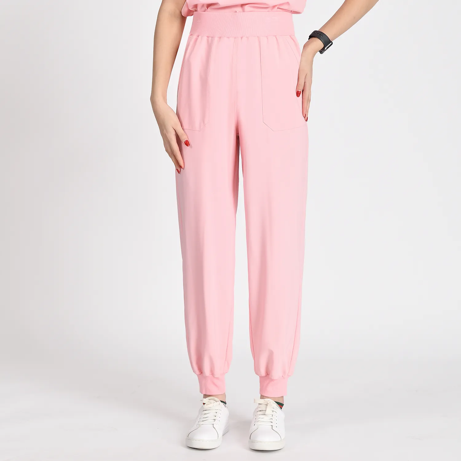 Pink fashion women’s scrub pants with elastic waistband and cuffs, offering a secure and comfortable fit for healthcare professionals.