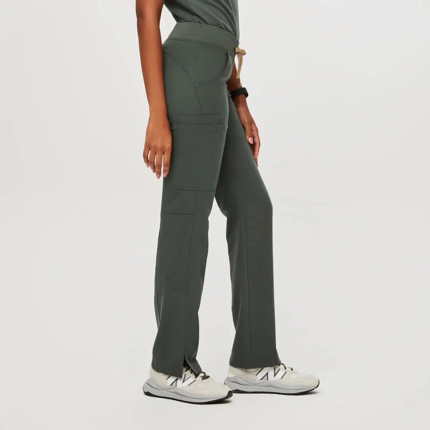 Fashion Women’s Medical Scrub Pants with Drawstring Waist for Comfort and Style Side view of women's green scrub pants with drawstring waist, featuring two pockets, designed for comfort and functionality in medical settings.