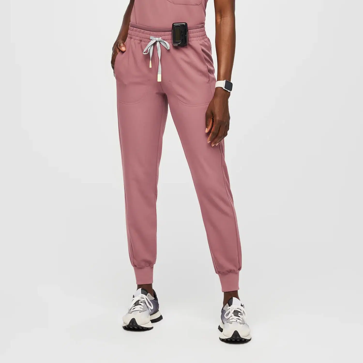Close-up of women's jogger-style medical scrub pants with a drawstring waist, two storage pockets, and tapered legs. Ideal for healthcare workers seeking comfort and style.