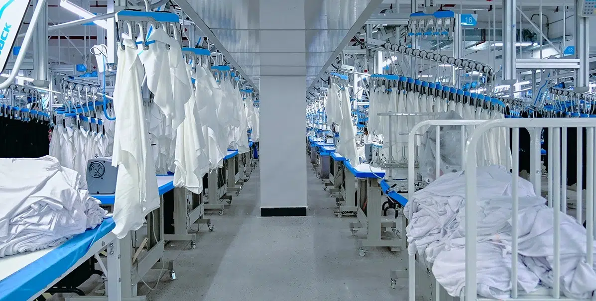 Standardized garment transport and QA system in a professional scrubs factory
